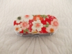 Pilulier argenté recouvert de papier japonais gauffré fond rouge et fleurs