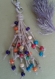 N°140 bijou de sac avec des perles en bois et du fil de lin écru