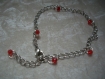 Bracelet perles rouges à facettes