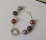 Bracelet fantaisie de perles magiques  et décoration argentée