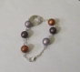 Bracelet fantaisie de perles magiques  et décoration argentée