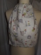Serviette bavoir tour de cou élastique motif multicolore  sur fond blanc imprimes teddy