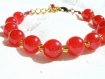 Bracelet rouge et doré en perles de verre 