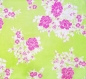 Tissu toile coton fleurs fuschia et blanches sur fond vert pomme 