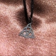 Collier triquetra charmed