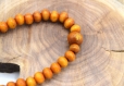 Bracelet bouddhiste élastique ajustable en perle de bois noir ou orange