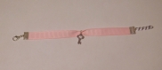 Bracelet rose avec sa clé 