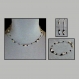 Ensemble collier, bracelet et boucles d'oreilles en chaine cobra argentée garnie de facettes transparentes irisées et de perles noires