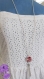 Jap - collier sautoir chaîne argentée, perle plate mouchetée rouge et pompon argenté