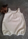 Barboteuse pour bébé en coton, en taille 6 mois couleurs douces.