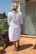Belle robe blanche courte crochetée entièrement à la main. très douce à porter sur la peau avec un boléro de la collection