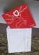Carte de voeux : rouge céleste (en papier recyclé de 270 g/m²).