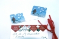 Lot de 12 étiquettes cadeau « zouik » illustrées d’un rouge-gorge sur une branche sous les flocons dans le ciel bleu