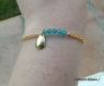 Bracelet doré et perles swarovski bleues cyan 