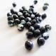 40 perles ovales facettées en verre noires avec reflets irisés