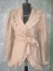 Beige coat with gold facial crucibles