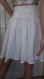 Elegant white ladies' skirt in pieces with a set and a ribbon of cotton with elastane