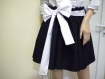 Elegant ladies' black skirt with white stitching and elastic waistband.