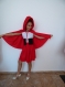 Costume - a red hat, a children's suit, a suit - a skirt of elastic, an elastic blouse, a corset belt and a cloak made of cotton.