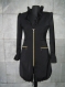 Ladies black mantle with gold zippers, made of black elastic fabric, plastic gold zips, model is size -