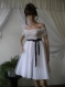 Elegant white dress, top lace with elastic, lower textile.