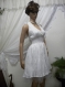 White ladies dress with bare back of fine white wrinkled cotton dress with crinoline, lace waist