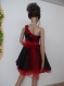 Elegant red dress with red flowers, red organza, one shoulder made of black satin with elastane and red organza