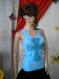 Ladies' light blue top with crystals.