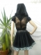 Elegant and unusual black dress of polyamide with turquoise lace