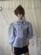 Ladies shirt with blue ribbon and puffed sleeves made of cotton