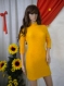 Elegant ladies' yellow tunic or mini dress with a nice knitted polo shirt