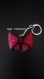 Porte clé tissé en forme de noeud papillon fuchsia et noir