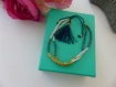 Bracelet d'amitié perles bleues et dorées avec pompon