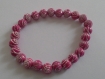 Bracelet élastique en perles roses motif spiral argent