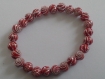 Bracelet élastique en perles rouges motif spiral argent