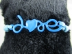 Bracelet en coton ciré bleu "love", avec tour de poignet réglable 