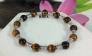 Bracelet bien-être en oeil de tigre ,pierre de protection, perles 8 mm et perles tonneau argent du tibet 
