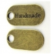 Breloque bronze ovale 'handmade' 