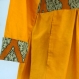 Robe longue safran et orange en coton, à corsage bustier boutonné , manches longues. 