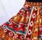 Jupe mi- longue à motif ethnique multicolores et ceinture muticolore élastiquée à la taille 