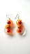 Boucles d'oreilles perles magiques orange et jaunes, sangle silicone 