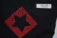 Trousse à tout, noire et motif évidé étoile rouge à paillettes