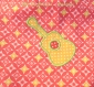 Bavoir bébé naissance 0-6 mois mixte motifs géométriques orange et jaune appliqué guitare 