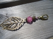 Bijou de sac ou porte clés avec perle craquelée transparente et prune 