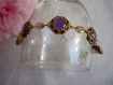 Bracelet métal doré et cabochons violets 