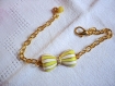 Bracelet métal doré et noeud jaune et blanc 