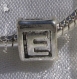 1 charm lettre "e" perle rondelle anneau en metal argente 15x5mm pour serpent *k31 
