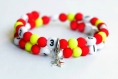 Bracelet d'allaitement sur fil à mémoire de forme de 55mm avec perles en acrylique de couleur rouge et jaune 