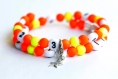 Bracelet d'allaitement sur fil à mémoire de forme de 55mm avec perles en acrylique de couleur orange et jaune 