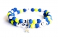 Bracelet d'allaitement sur fil à mémoire de forme de 55mm avec perles en acrylique de couleur bleu et jaune 